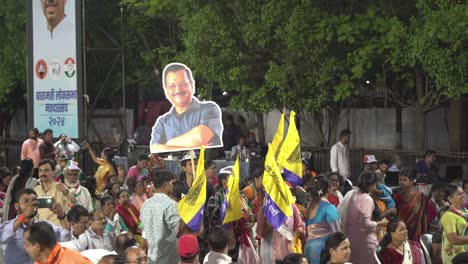 Chief-Minister-of-Delhi-Arvind-Kejriwal-promotional-display,-party-workers,-flags-and-supporters-during-Lok-Sabha-election-campaign-by-Uddhav-Thackeray-at-college-ground-in-Warje