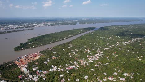 Areal-view-of-Mekong-river-delta-over-coconut-plantations-at-Bến-Tre,-Vietnam,-Asia