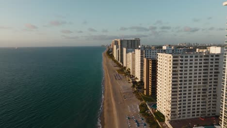 Drone-overlooking-condos-on-a-beachfront-in-Fort-Lauderdale,-Florida