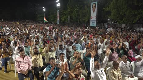 Large-crowd-of-excited-Indian-people-cheering-and-slogan-shouting-during-Lok-Sabha-election-campaign-by-Uddhav-Thackeray-and-Sharad-Pawar-at-college-ground-in-Warje