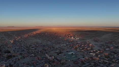 Sunrise-Uyuni-salt-flats-town-city-drone-aerial-view-bolivia-south-america-Train-Cemetery
