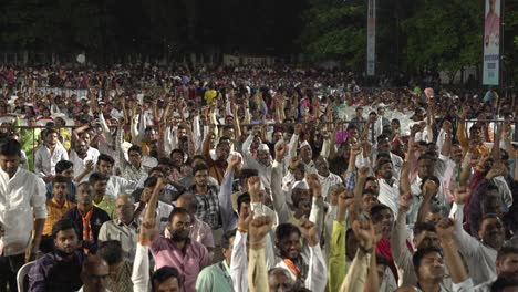 Large-crowd-of-Indian-people-slogan-shouting-at-Lok-Sabha-election-campaign-by-Uddhav-Thackeray-and-Sharad-Pawar-at-college-ground-in-Warje