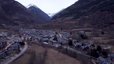 Bird's-eye-view-establishing-in-the-village-of-Benasque-in-the-province-of-Huesca,-snowy-mountainous-region-of-the-Pyrenees,-Aragon,-Spain