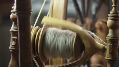 Soft-light,-soft-focus-vintage-Nordic-spinning-wheel-making-wool-yarn