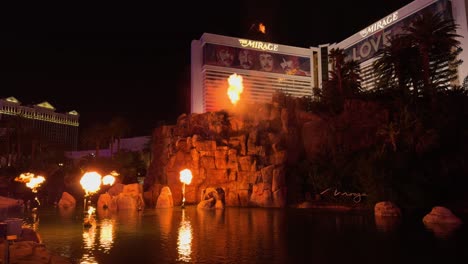 Fiery-spectacle-at-The-Mirage-in-Las-Vegas:-the-iconic-volcano-show-erupts-against-the-night-sky,-framed-by-the-lit-up-hotel-facade