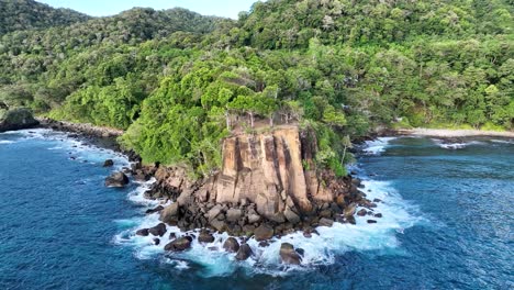 Waves-crashing-against-unyielding-coastal-rocks,-Weh-Island,-Indonesia