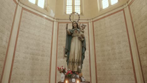 Pilgrim-Madonna-And-Baby-Jesus-With-Burial-Niches-of-the-Fallen-Soldiers-At-Ossuary-Temple-In-Bassano-del-Grappa,-Italy