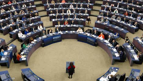 European-Parliament-members-attending-the-plenary-session-while-speaker-talks-in-Strasbourg,-France---Medium-shot