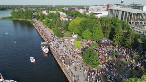 Residents,-tourists-celebrate-start-of-summer-on-Parnu-River,-Estonia