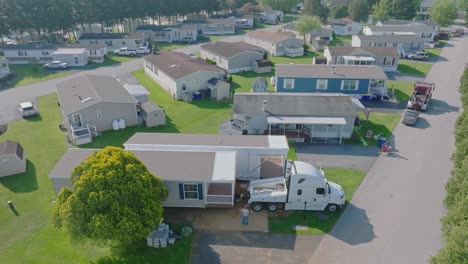 MayAn-Aerial-View-of-a-Manufactured,-Mobile,-Prefab-Double-Wide-Home-Being-Installed-in-a-Lot-in-a-Park