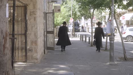 Jewish-people-walking-in-the-street-in-Jerusalem,-Israel