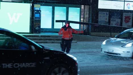 Traffic-marshal-coordinating-traffic-along-Davos-town-centre-high-street