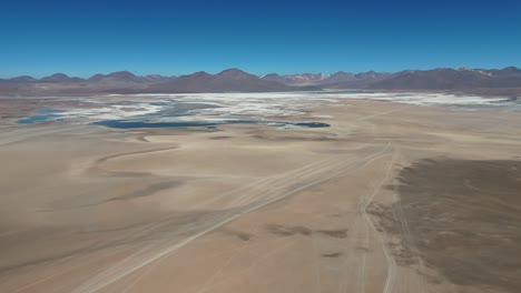 drone-aerial-view-of-Salar-de-Uyuni-salt-flats-bolivia-desert-mountains-landscapes-south-america