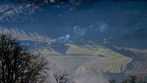 A-static-shot-of-a-tiny-house-with-a-chimney-releasing-smoke