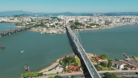 A-panoramic-view-captures-the-iconic-Hercilio-Luz-Bridge-in-Florianopolis,-Santa-Catarina,-Brazil,-on-a-bustling-day-with-heavy-traffic