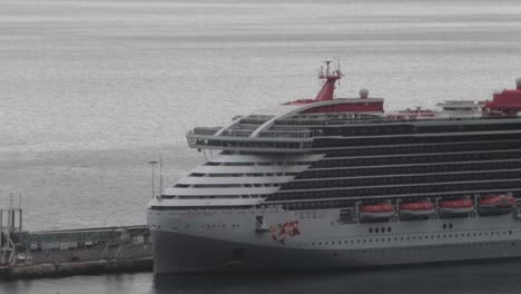 Virgen-Voyage´s-SCARLET-LADY-luxurious-adult-passenger-cruise-ship-docked-in-Funchal-city---Madeira-Island-on-a-overcast-day