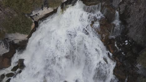 Rushing-Owen-Sound-waterfall-from-above-in-Ontario,-Canada,-powerful-nature-scene