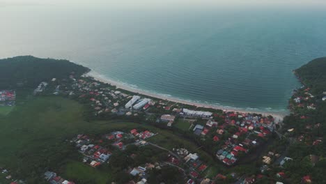 Aerial-view-captures-the-stunning-sunset-over-Lagoinha-da-Ponta-das-Canas-Beach-in-Florianopolis,-Santa-Catarina,-Brazil