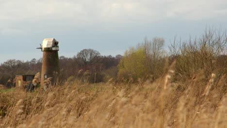 wide-shot-of-a-derelict-water-mill-with-reeds-in-foreground-on-the-river-Ant-at-the-Norfolk-Broads