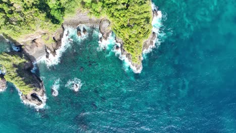 Turquoise-sea-water,-dramatic-cliffs,-tropical-scenery,-birdseye-view