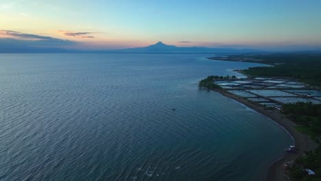 Aerial-wide-shot-of-Matutum-stratovolcano-at-sunrise-near-General-Santos-Town,-Philippines