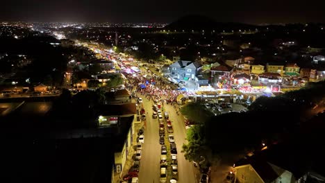 Cars-park-along-both-sides-of-roads-as-traffic-is-diverted-for-Carnaval-Parade-at-night