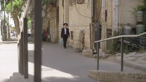 Jewish-man-walking-in-the-streets-of-Jerusalem,-Israel