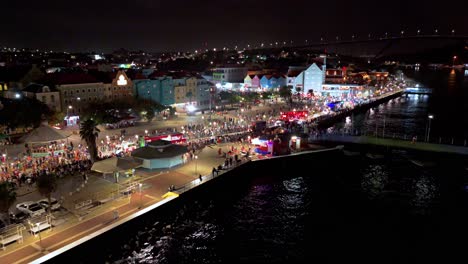 Drone-dolly-to-Carnaval-Gran-Marcha-parade-performers-at-night