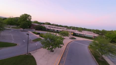 Aerial-approaching-shot-of-Kissel-Hill-Elementary-School-in-Lititz-during-blue-hour-in-American-Town