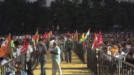 Political-flags-and-mass-gathering-of-people-during-Lok-Sabha-election-campaign-by-Uddhav-Thackeray-and-Sharad-Pawar-at-college-ground-in-Warje