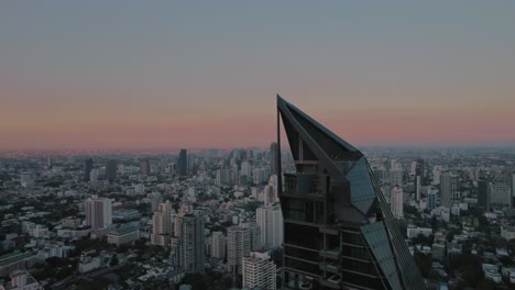 Drone-view-of-skyline-of-Bangkok-city-during-sunset-in-Thailand