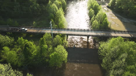 Kayakers-On-Flowing-Wolf-River-Passing-By-Under-Road-Bridge-In-Collierville,-Tennessee