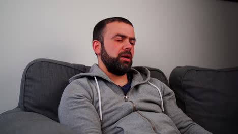 Middle-Eastern-Guy-Looking-Upset-While-Talking-To-Someone-At-Home