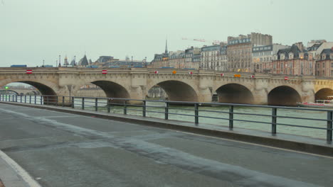 Runner-passing-by-in-Pont-Neuf-Cycling-lane-region-in-Paris-city,-France