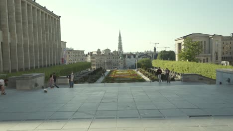 PEOPLE-WEARING-AMSKS-AND-WALKING-IN-THE-CITY-CENTER-OF-BRUSSELS---BELGIUM-DURING-THE-LOCKDOWN-AS-THE-GOVERNMENT-STARTED-OPENING-UP-THE-MARKETS-AND-MUSEUMS