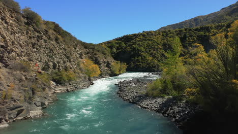 Kawarau-River-near-Queenstown,-New-Zealand-is-famous-for-extreme-sports-like-bungy-jumping-and-rafting---aerial-flyover