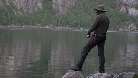 Masked-Man-Fishing-at-a-Lake