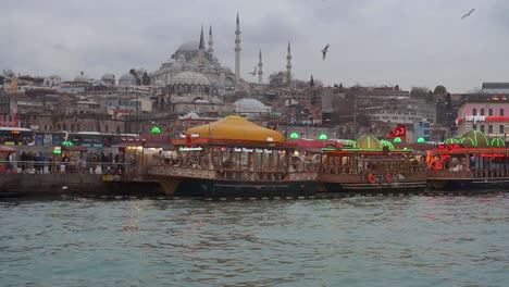 Eminonu-harbor-with-a-range-of-boat-restaurants-and-loud-shrieking-gulls-above