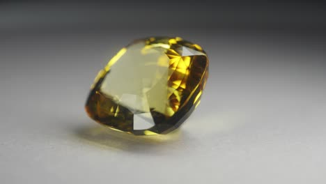 Polished-yellow-gemstone-rotates-and-sparkles