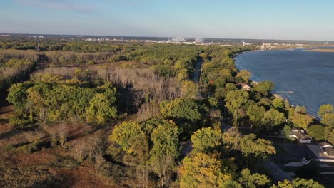 Aerial-drone-view-of-Green-Bay-Wisconsin-nature-preserve-The-Wildlife-Sanctuary-across-the-road-from-houses