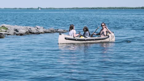 A-young-Caucasian-family-canoes-through-a-calm-bay