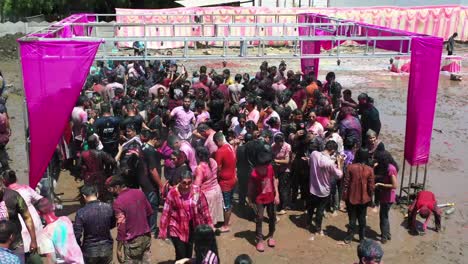 Many-people-are-playing-with-different-colors-and-bathing-in-water