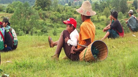 Burmese-people-watching-local-games-on-the-way-of-hiking-from-Kalaw-to-Inle-Lake,-Burma,-Myanmar