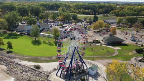 Aerial-view-of-Green-Bay-Wisconsin-Bay-Beach-Amusement-Park-with-ferris-wheel,-main-building-and-parking-lot
