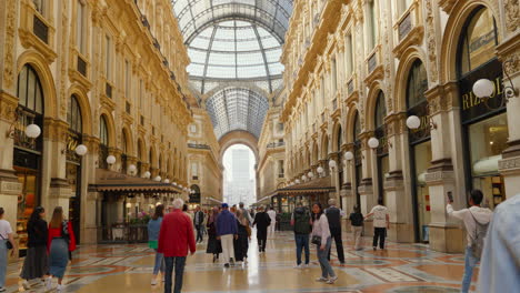 Scenic-view-inside-iconic-Milanese-arcade-with-bustling-crowd