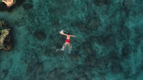 Top-view-shot-of-a-swimming-person