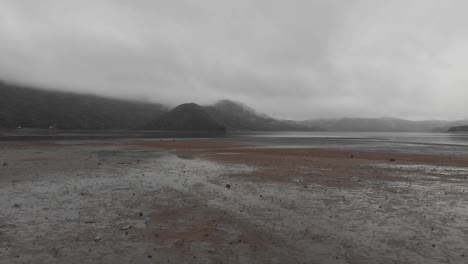 Aerial-clip-going-backwards-of-moody-beach-in-Georgia,-during-a-cloudy-day