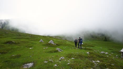 Two-hikers-hiking-alone-along-the-trail-in-the-mountains-on-a-sunny-day-in-Croatia