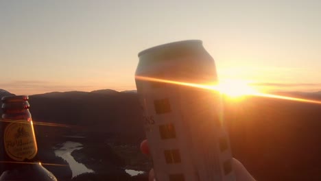 Slow-motion-shot,-people-celebrating-clinking-drinks-at-idyllic-Sunset-view