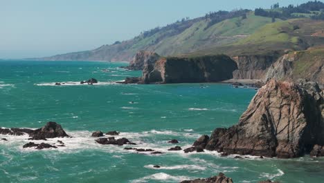 Drone-shot-slowly-panning-out-away-from-the-coast-on-a-windy-day